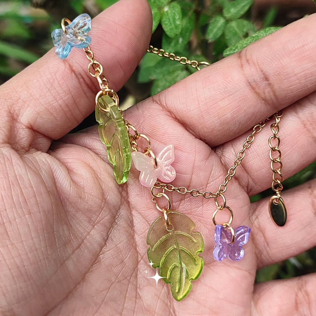 Pulseras de acero inoxidable con dijes de mariposas y hojas (GBR-PAI-HM-MIX)